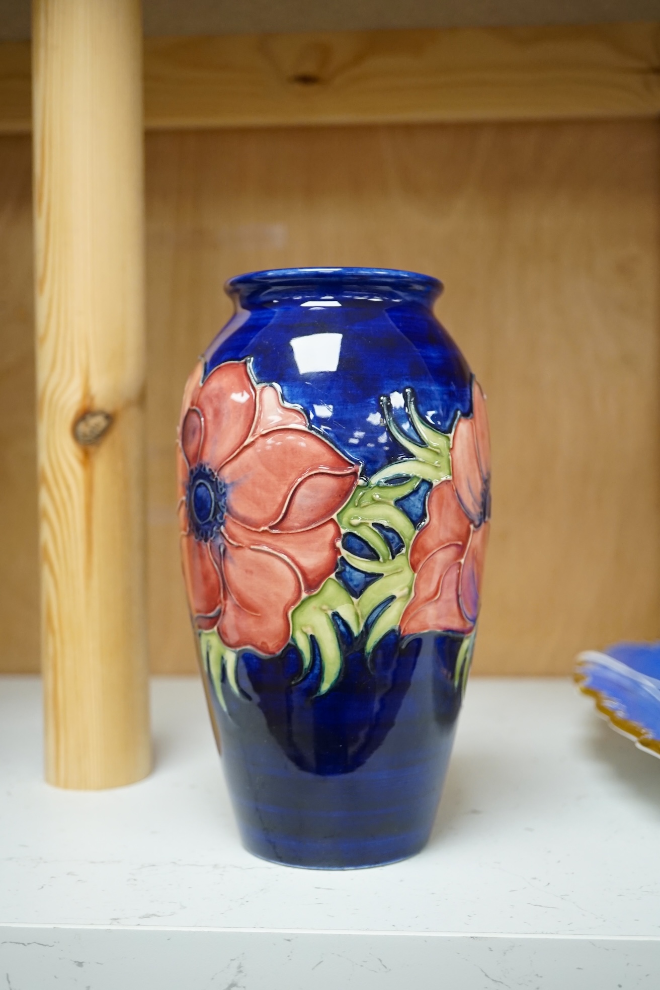 A Moorcroft anemone pattern vase, 18.5cm tall. Condition - good